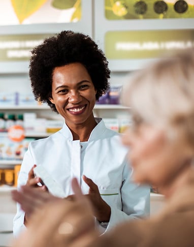 Pharmacist assisting customer